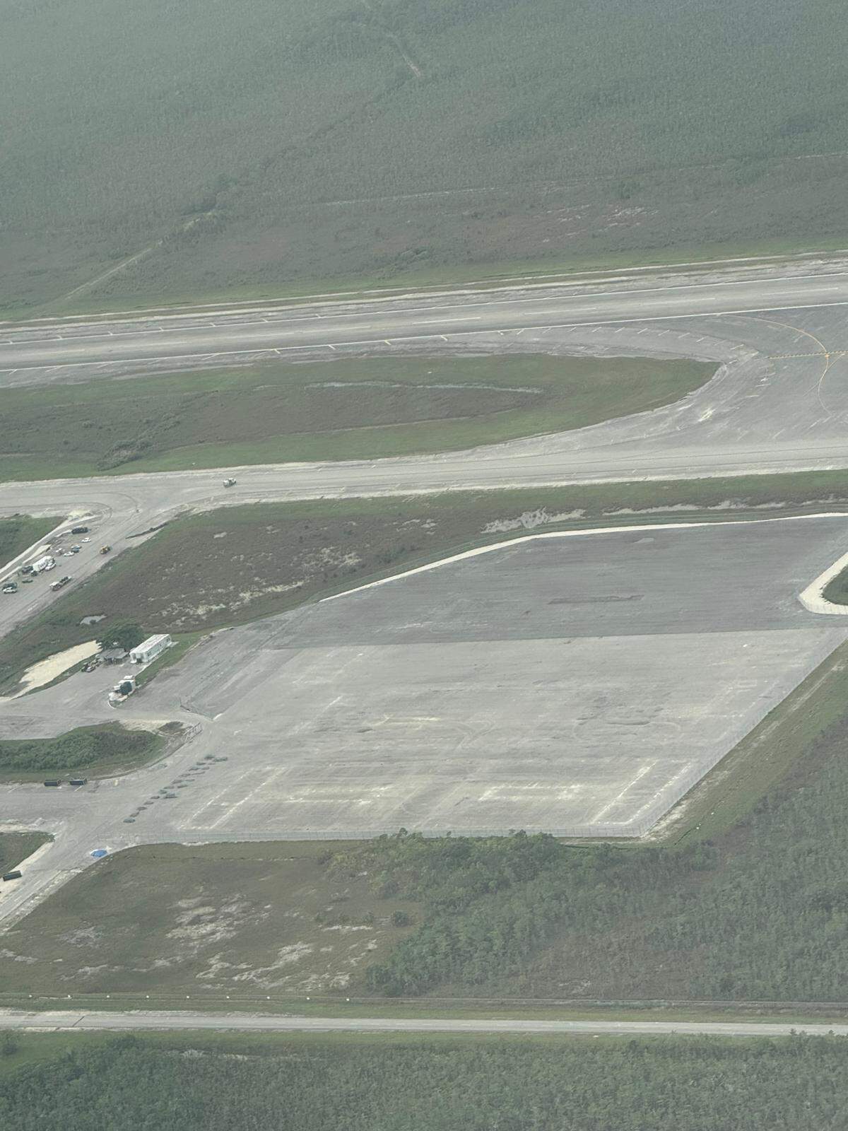 An aerial photo shows all the white industrial tents that once transformed the Dade-Collier Training and Transitional Airport into the immigration detention center Alligator Alcatraz have been taken down. The trailers, diesel powered generators and tanks have been removed.